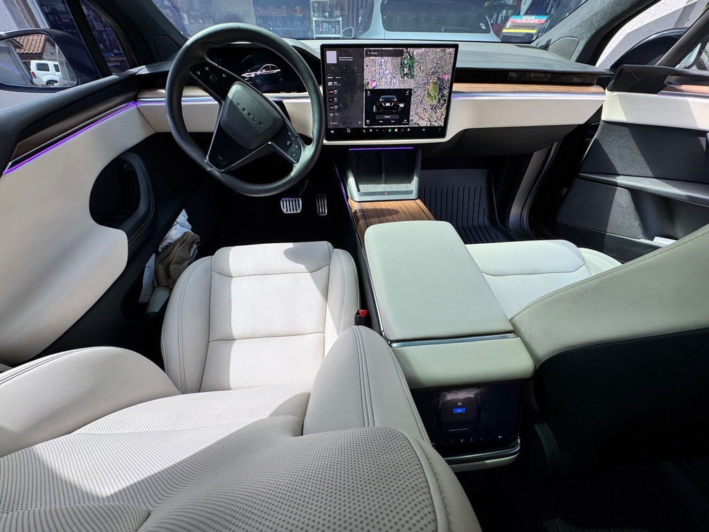 Tesla Model X front cabin, white interior, with purple door ambient lighting