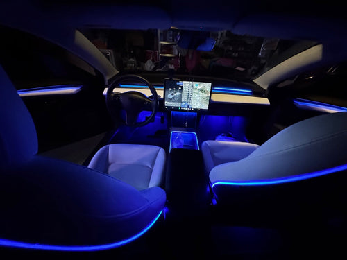 Tesla Model 3 cabin with blue TslaModz Deluxe ambient lighting installed